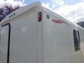 A 2004 Royal 18 Foot Office Trailer featuring a smooth white exterior with red and black accent stripes and rear lights