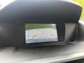 Rearview camera display in a 2016 Ford Transit Connect showing guidelines for parking and maneuvering