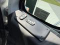 A control panel with two buttons labeled for door operation on the interior of a 2009 International 7500 truck