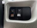 Close-up of two toggle switches labeled Work Light and Fog Light both in the ON position on a vehicle dashboard