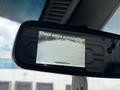 A rearview mirror displaying a camera feed with a caution message to check entire surroundings in a 2020 Mercedes-Benz Sprinter