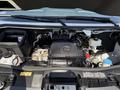 Close-up view of the engine compartment of a 2023 Mercedes-Benz Sprinter showcasing various components including the engine and fluid reservoirs