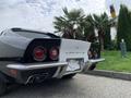 A black and white 1972 Chevrolet Corvette with distinctive round taillights and a sleek design