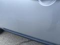 A silver 2006 Land Rover LR3 with noticeable scratches on the door panel