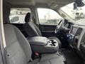 Interior view of a 2019 RAM 1500 Classic showing the driver and passenger seats with a center console and dashboard controls visible