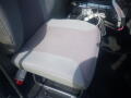 The interior seat of a 2016 International WorkStar 7500 with gray and patterned fabric and a metal frame