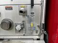 Control panel of a 2009 Spartan Gladiator featuring various knobs and switches for operational functions