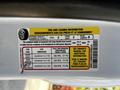 A yellow and white tire information sticker displaying details about tire pressure and load capacity for a 2021 Ford Transit