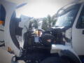 A 2016 International WorkStar 7500 with its hood raised reveals the engine compartment showcasing various engine components and wiring