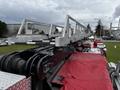 A 2009 Spartan Gladiator fire truck featuring a ladder assembly on the top with metallic components and red fabric covering the truck's body