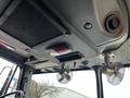 Interior view of a 2009 Spartan Gladiator truck featuring overhead controls two small fans and a ventilation system