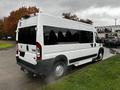 A 2016 RAM Promaster van with a white exterior and tinted windows parked with steam rising from the ground