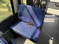 A blue fabric seat in a 2020 Chevrolet Express with a keychain resting on it