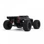 A black Arrma 1/5 Outcast 8S EXB AVC 4X4 RTR Brushless Stunt Truck with large rugged tires and a detailed chassis