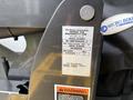 A metal label attached to equipment displaying information including model number, serial number, and manufacturing date for a Braun Corporation product associated with a Chevrolet Express