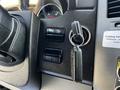 Close-up of the dashboard of a 2017 Mercedes-Benz Sprinter showing the steering wheel ignition key and control buttons