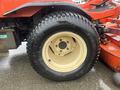 A close-up of a tire from a 2010 Kubota F3680 featuring a beige rim and a tread with the brand name visible along the sidewall
