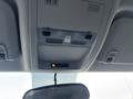 Interior view showing the overhead console of a 2011 Chevrolet Avalanche with light switches and an information display