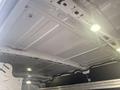 Interior view of a 2017 Ford Transit van showing the ceiling with LED lights and metal framework