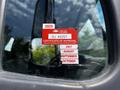A 2010 Freightliner M2 106 truck displaying a red British Columbia certificate of approval sticker with the year 2025 and months listed as July August September October