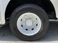 A close-up of the tire and wheel of a 2008 Morgan Olson Workhorse showing a white alloy wheel and a thick black rubber tire with visible tread