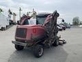A 2012 Toro Groundsmaster 5910 lawn mower with large cutting decks and a red body parked on a lot