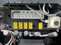 Control panel of a 2017 International WorkStar 7600 with labeled switches and gauges for operational functions