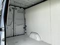 Interior of a 2012 Mercedes-Benz Sprinter van showing the empty cargo space with white walls and floor