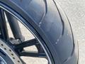 Close-up of a 2020 Kawasaki Vulcan S motorcycle tire showing tread patterns and details of the rim