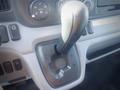 Close-up of the gear shift lever in a 2013 Mitsubishi Fuso FE 160 featuring positions for drive reverse and neutral