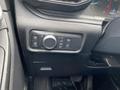 Control panel in a 2021 Ford Explorer featuring various knobs and buttons for lighting and hazard functions
