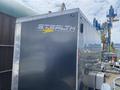 A silver 2020 Stealth Enterprises trailer with the logo prominently displayed on the side