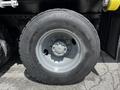 A close-up of a grey tire mounted on a wheel from a 2010 Freightliner M2 106 with the words Highway Control and Goodyear visible on the tire sidewall