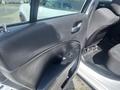 A 2017 Dodge Charger with a black interior and door panel visible featuring controls for windows and locks