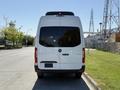 A 2023 Mercedes-Benz Sprinter van viewed from the rear showcasing its sleek design and large rear doors