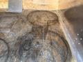 A 2012 Chevrolet Express van with a worn wooden floor showing circular impressions from the vehicle's interior components