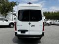 A 2019 Mercedes-Benz Sprinter van viewed from the rear with a white exterior and the model name displayed on the back door