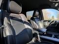 A 2023 RAM 3500 interior featuring leather seats with detailed stitching and a console between the front seats