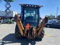 A 2008 Case Super 580M backhoe loader facing forward with visible front loader arms and rear excavator bucket