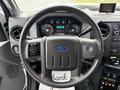 Steering wheel and dashboard of a 2011 Ford F-550 with instrument cluster and dashboard controls visible