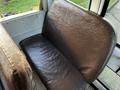 A brown vinyl seat inside a 2005 Blue Bird 48 passenger bus