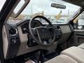 Interior view of a 2008 Ford F-350 with a steering wheel dashboard and controls visible