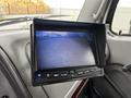 A monitor displaying a rearview camera feed inside a 2006 Freightliner M2 112 truck cabin