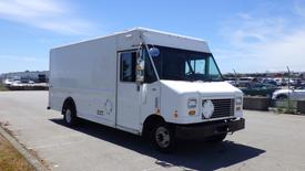 White 2011 Ford Econoline delivery truck with a boxy shape and front grill visible