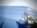 A blue 2017 Mercedes-Benz Sprinter van with a smooth surface and prominent reflections