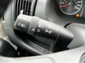 A close-up view of the control stalk in a 2021 RAM Promaster featuring buttons for headlights wipers and turn signals