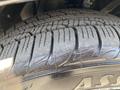 Close-up of a tire from a 2019 Dodge Charger showing deep tread patterns and markings on the sidewall