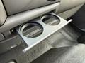 A dual cup holder is extended from the dashboard of a 2008 International CityStar vehicle