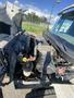 A 2014 International 7400 truck with its hood open revealing the engine compartment and various mechanical components