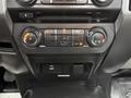 The image shows the climate control panel of a 2018 Ford F-150 featuring knobs for temperature and fan settings along with various buttons for air conditioning functions